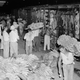 Banana loaders unload a car of bananas of the first shipment at the United Fruit Company docks for transfer to a waiting ship in Puerto Cortes, Honduras on Sept. 3, 1954. About 34,000 bunches made up the first shipment in over two months. In the foreground are bunches of bananas rejected for shipment because of over-ripeness. These will be given to workers for their consumption. (AP Photo